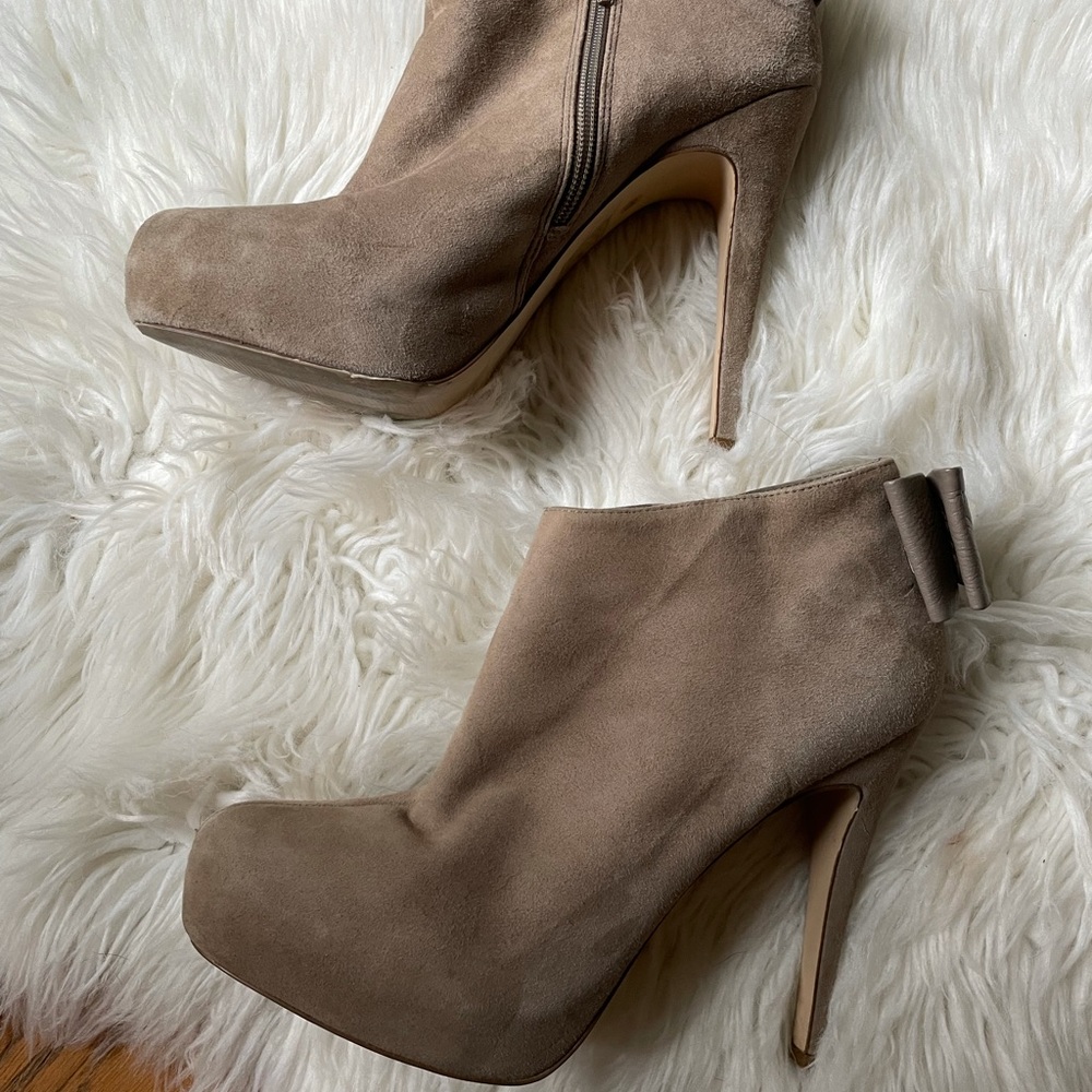 Super cute very comfortable dolce vita platform booties with bow.